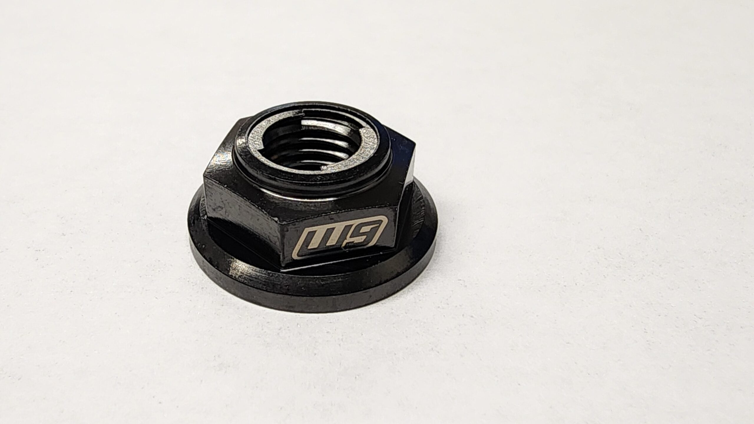 Warp 9 titanium swingarm replacement nut with Fuji spring lock for Sur-Ron Light Bee