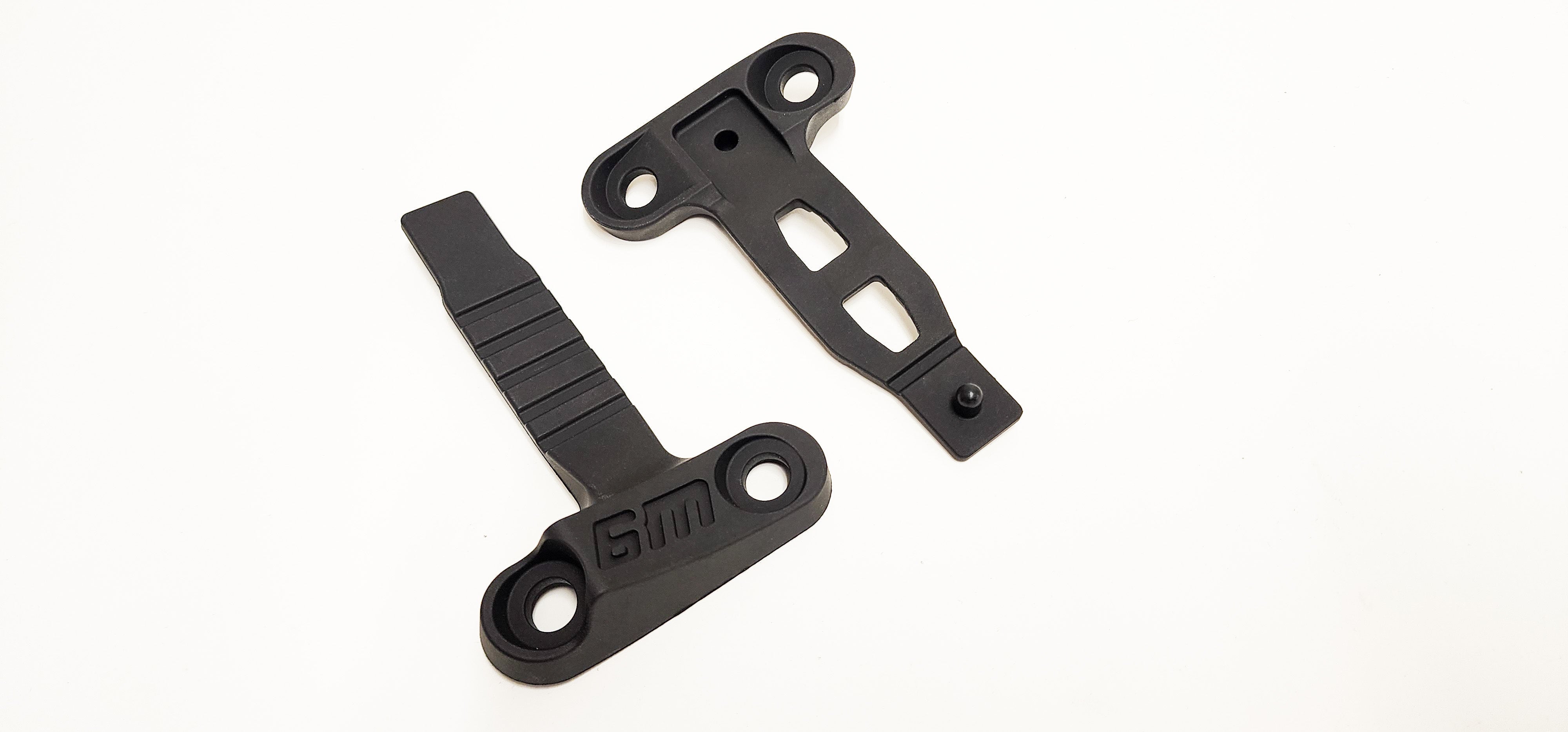 Bolt-on steer stops installed on a Sur-Ron Ultra Bee frame