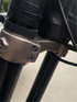 Titanium triple clamp bolts close-up showing machined finish