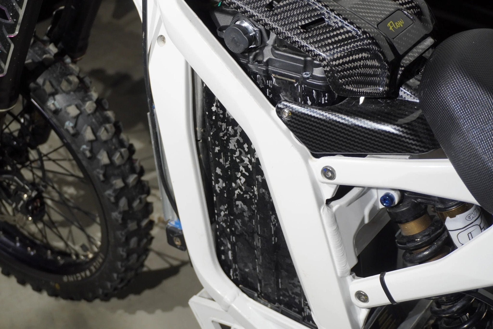 Talaria battery showing stealth black camo wrap look