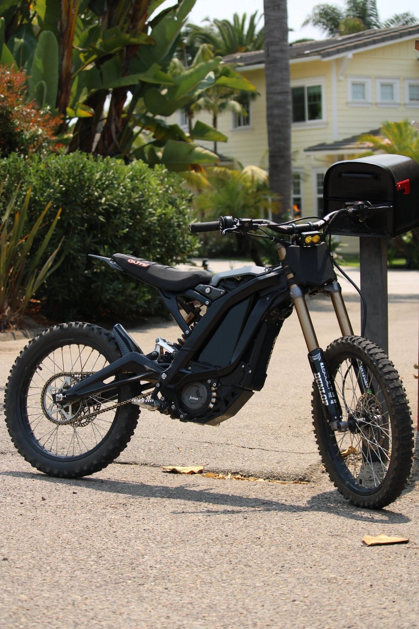 Reflective invisible wrap applied to an e-moto battery