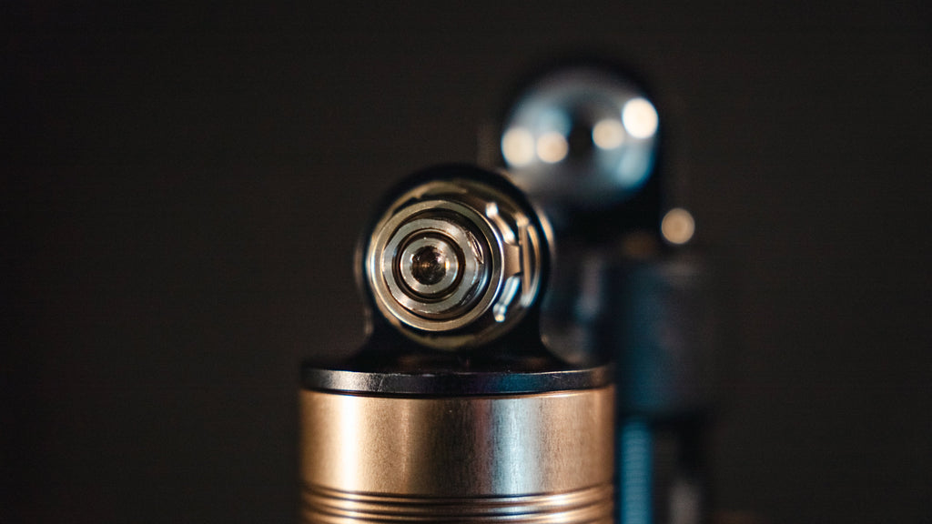 EXT REA MX shock — spherical bearing mounting hardware