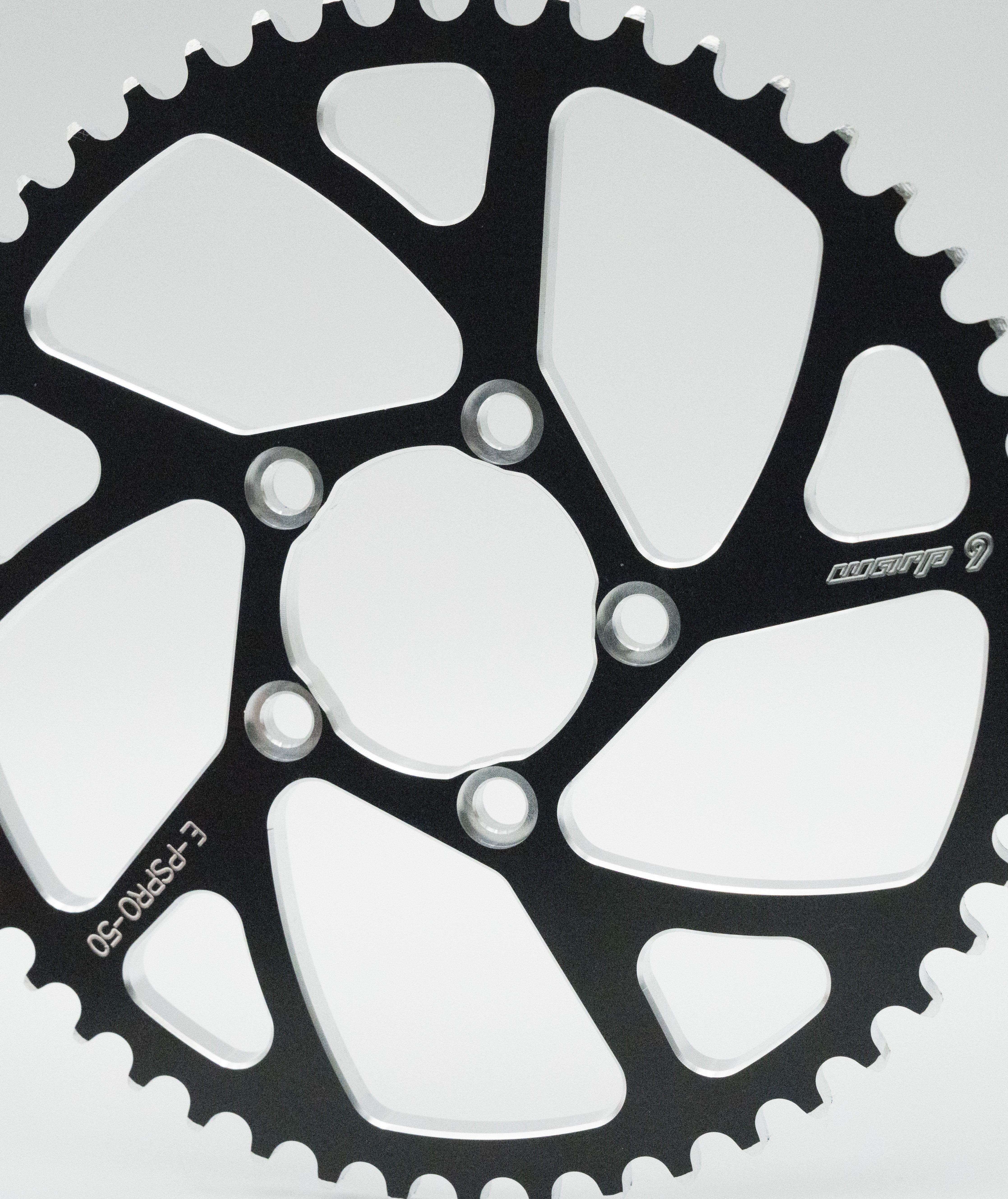 Warp 9 E-Ride Pro sprocket showing bolt holes and tooth profile