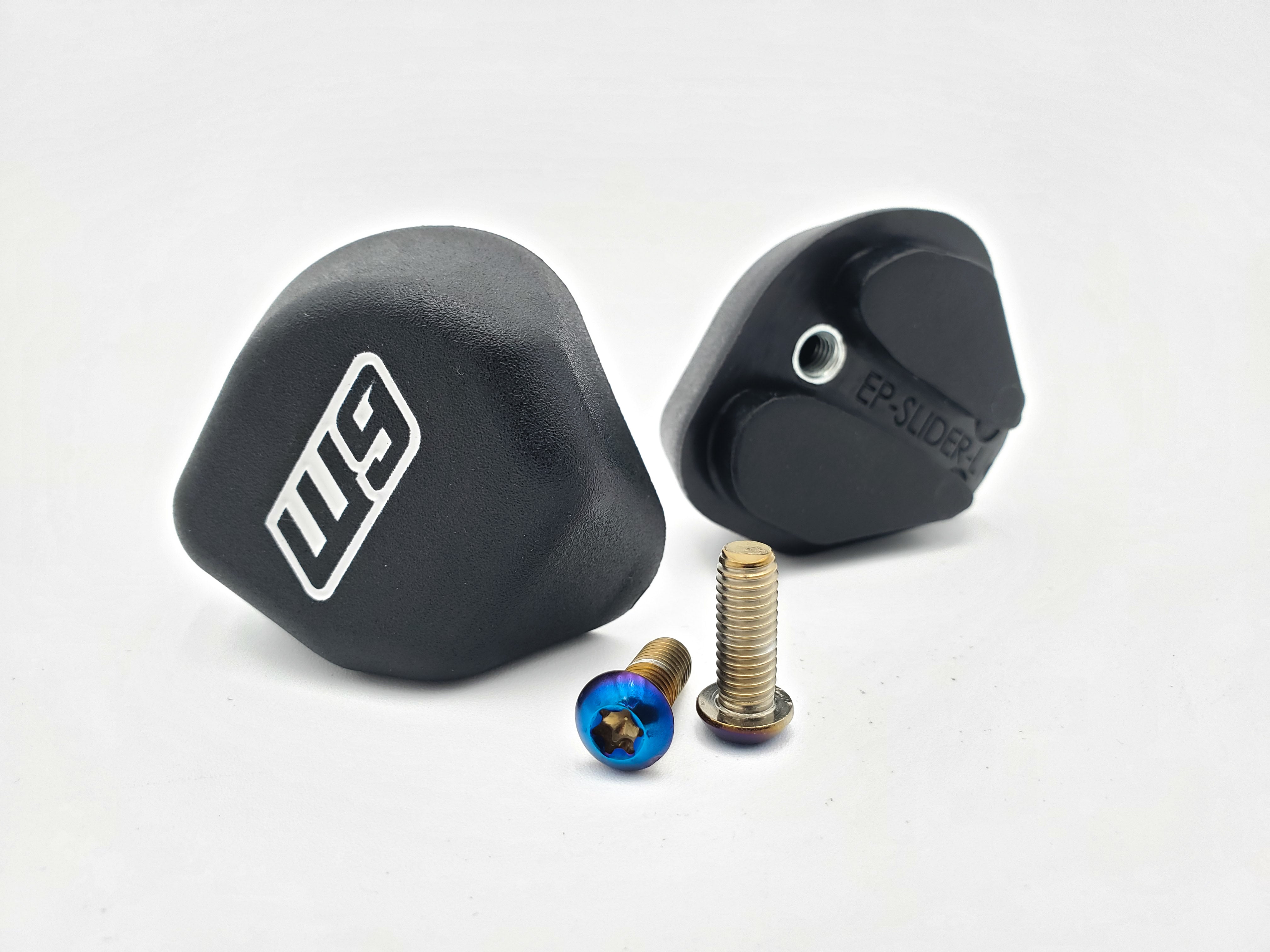 Warp 9 Elite foot peg sliders bolted to Elite Style pegs for Supermoto