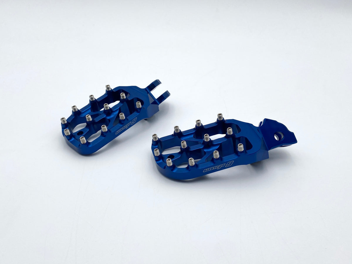Blue anodized Warp 9 Elite foot pegs for the Altis Sigma