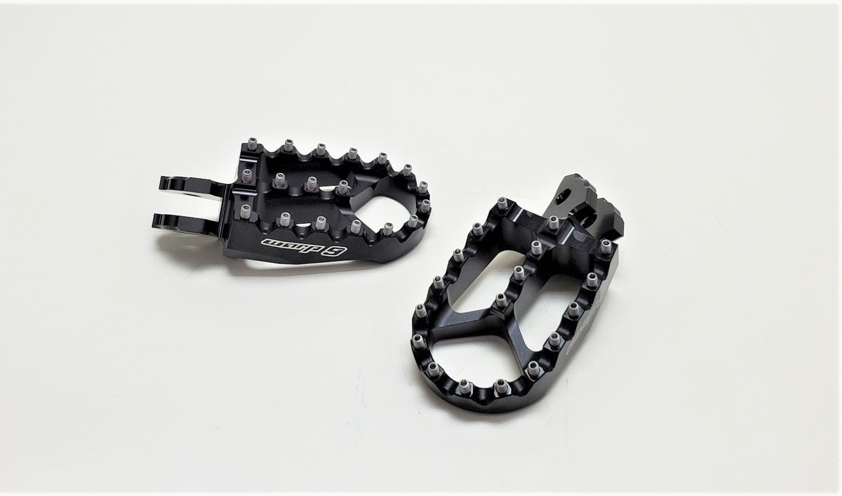Black anodized Warp 9 foot pegs for the Talaria Sting