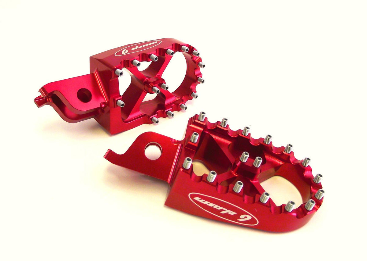 Red anodized Warp 9 foot pegs for the Altis Sigma