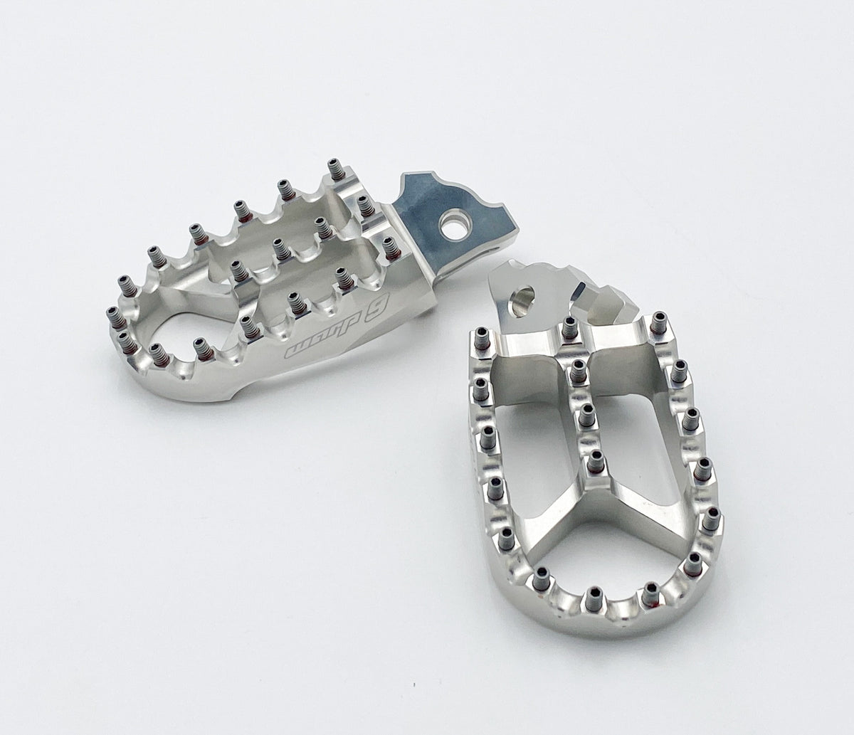 Silver Warp 9 wide-platform foot pegs with Y-bridge center teeth