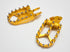 Gold anodized Warp 9 foot pegs for the Talaria Sting