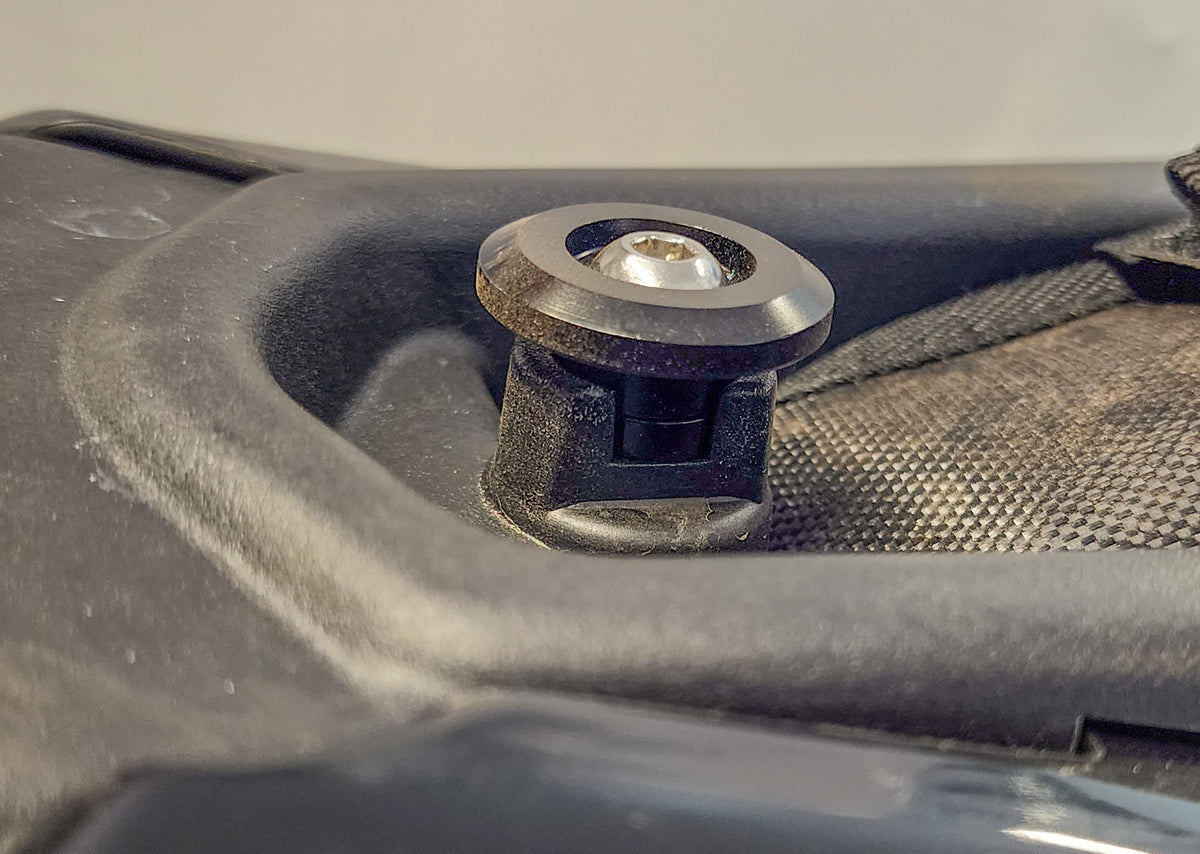 Bolt-on seat height riser installed on a Sur-Ron Ultra Bee