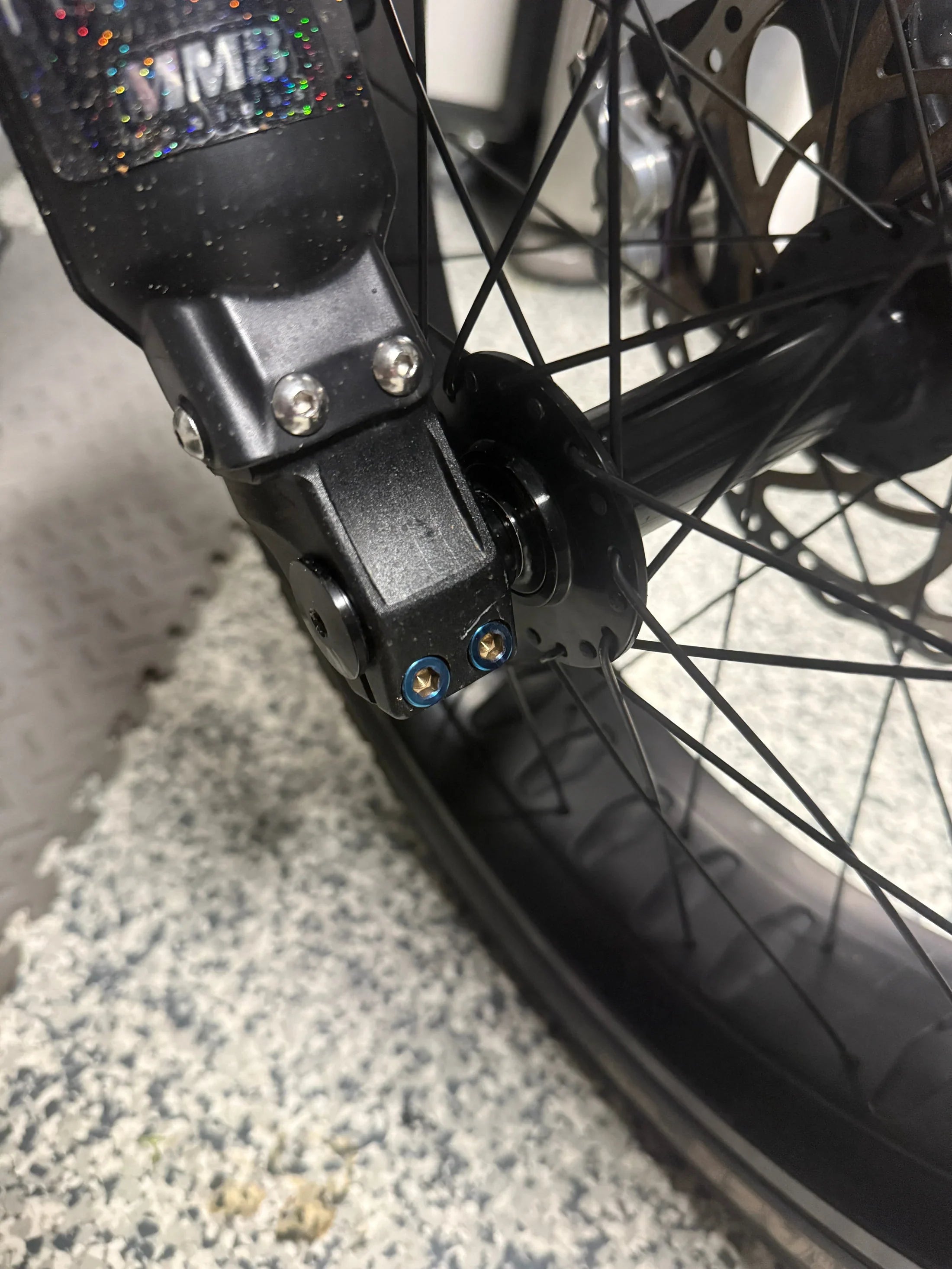 Close-up of titanium bolt threading and finish for Super 73 kit
