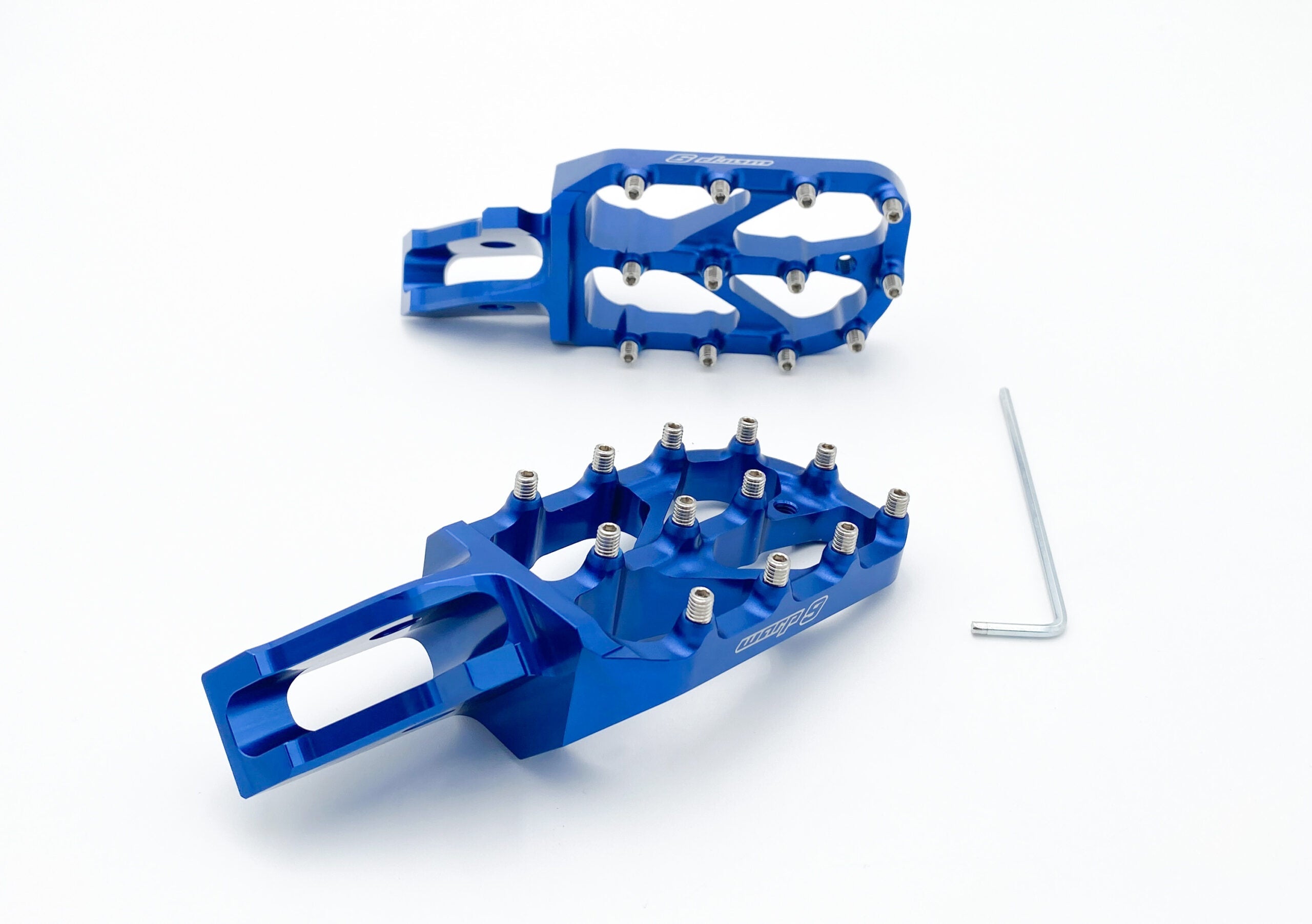 Red anodized Warp 9 Elite foot pegs with stainless teeth