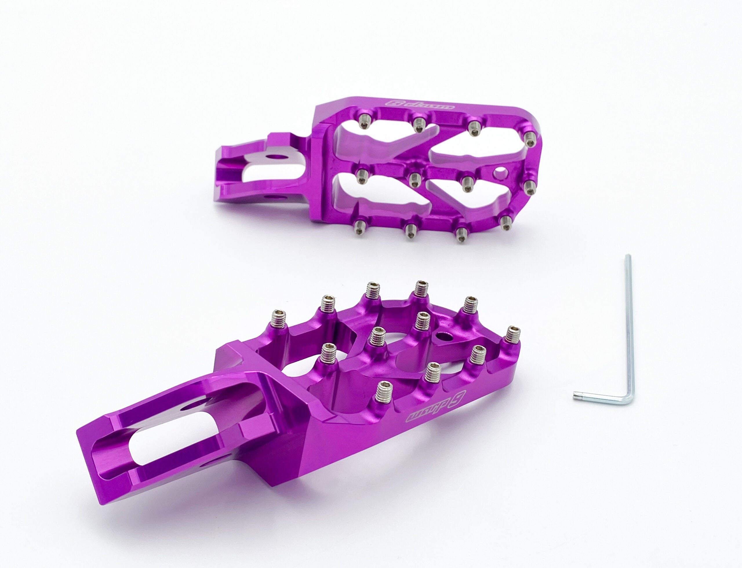 Gold anodized Warp 9 Elite foot pegs showing the 89 by 58mm platform
