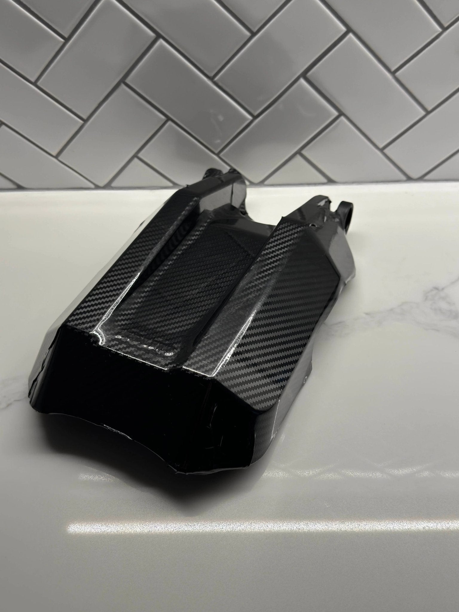 Carbon fiber vinyl wrap on E-Ride Pro side panel