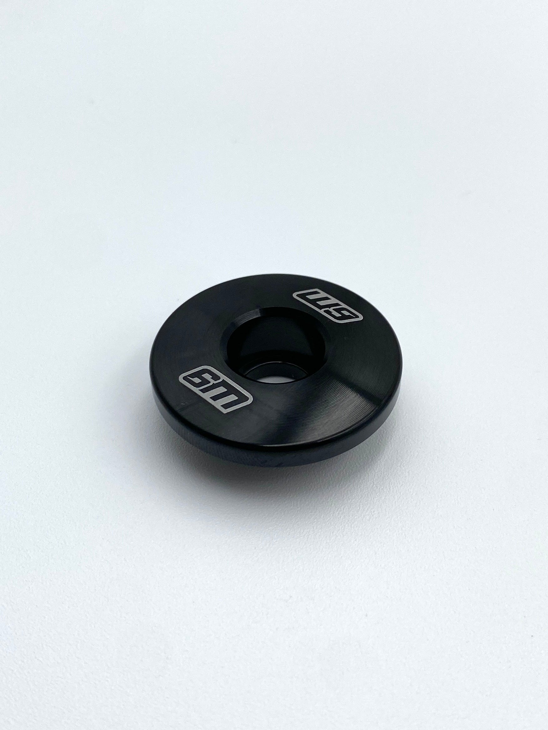 CNC-machined Warp 9 steer lock cap shown in multiple anodized colors