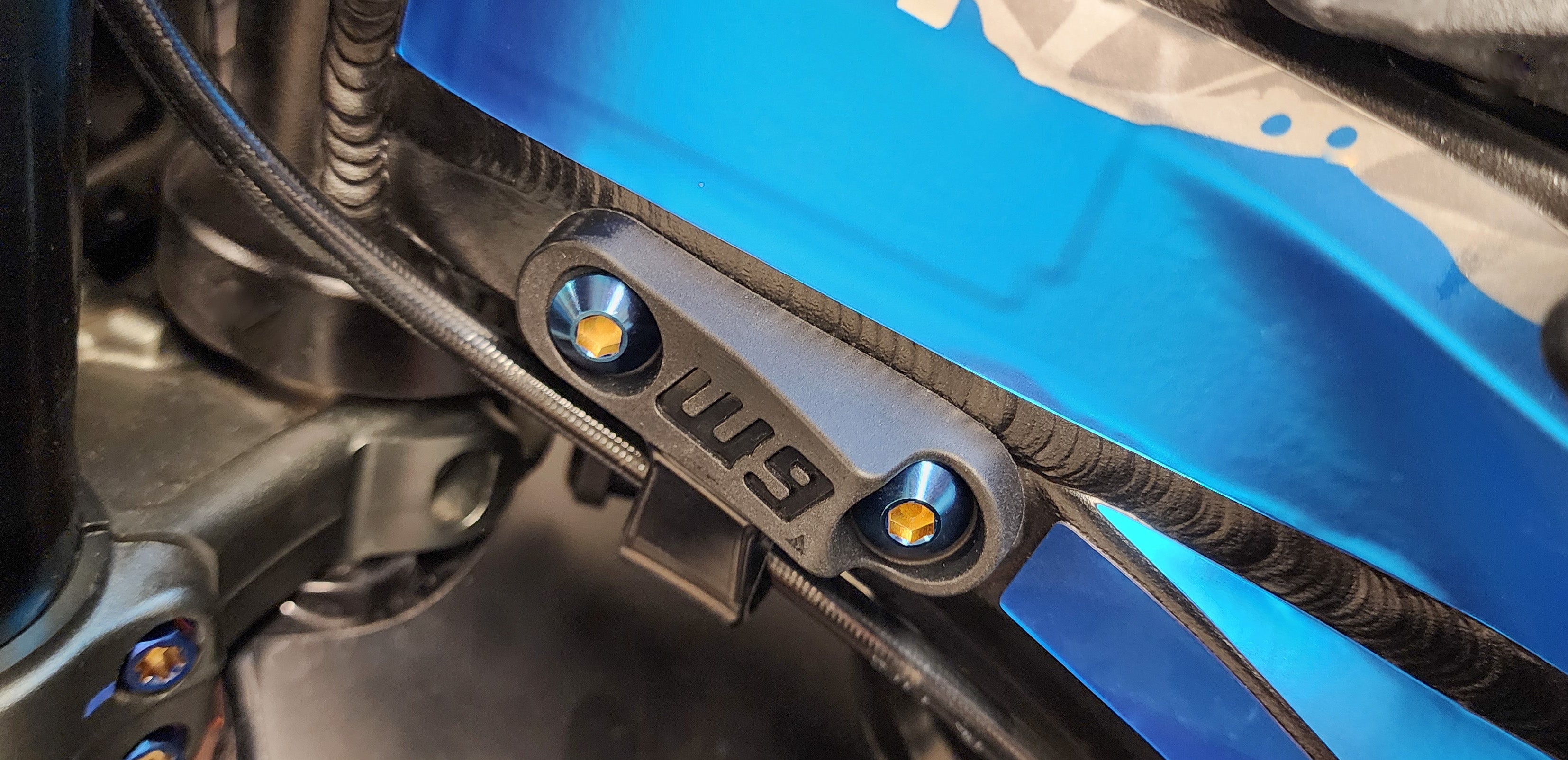 Rubber-molded steer stops shown shorter than stock for more steering angle