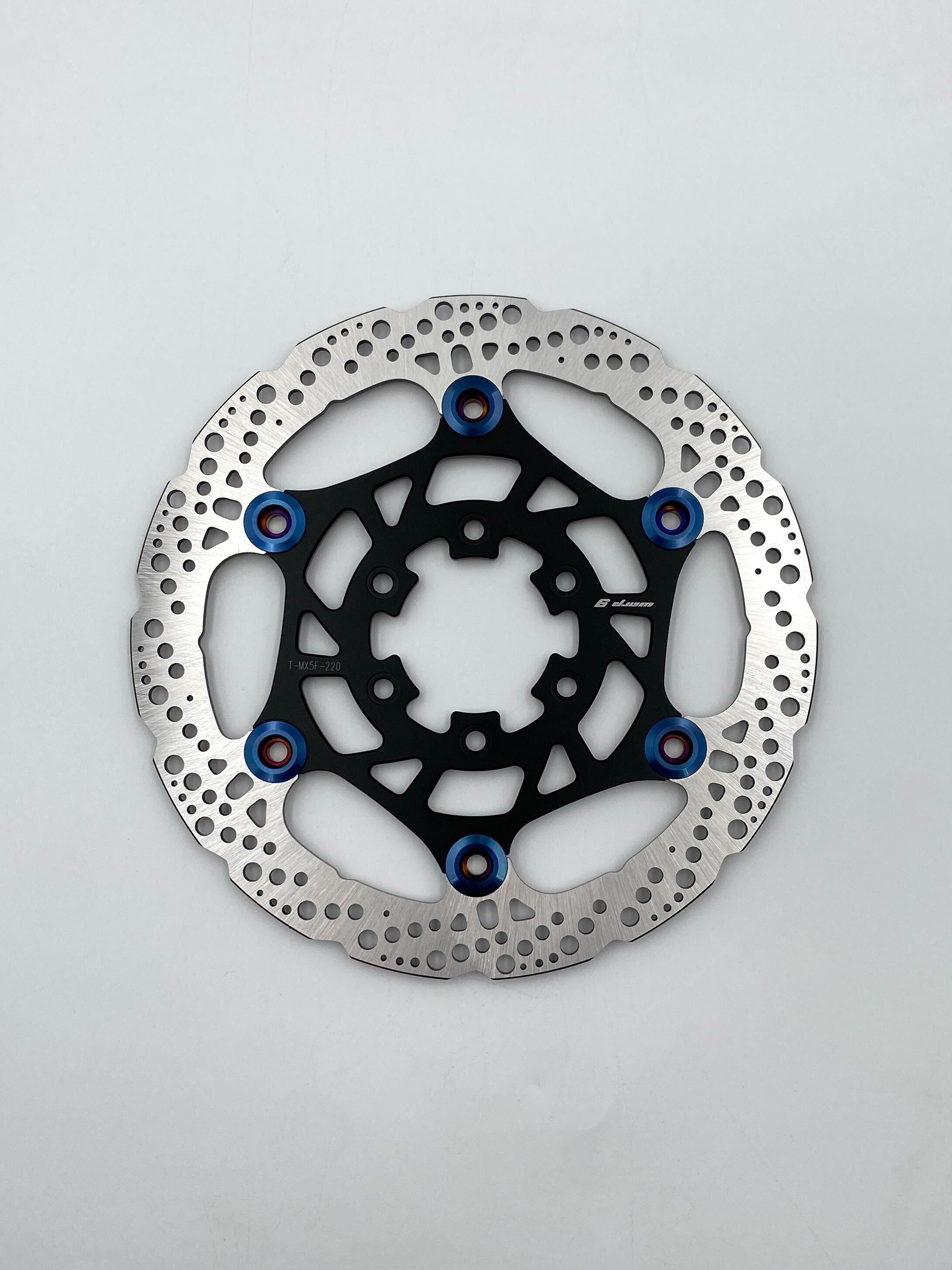 Warp 9 floating brake rotor for Talaria MX5 showing rivets and vents