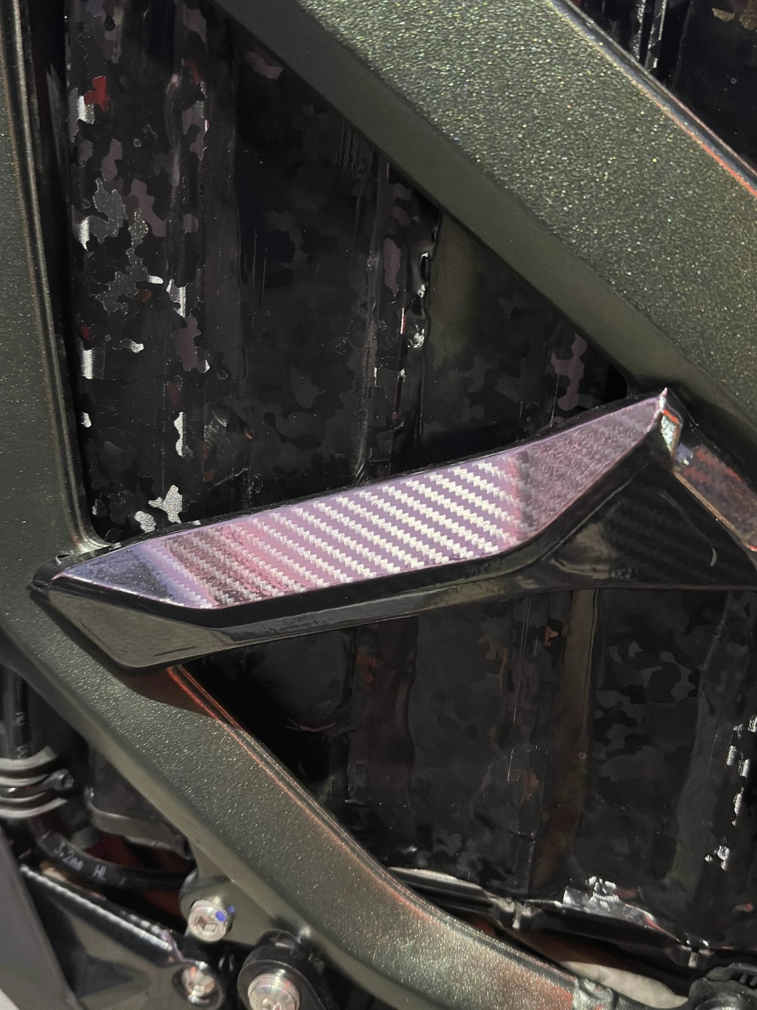Carbon fiber fork guards and fender wrap on Sur-Ron Ultra Bee
