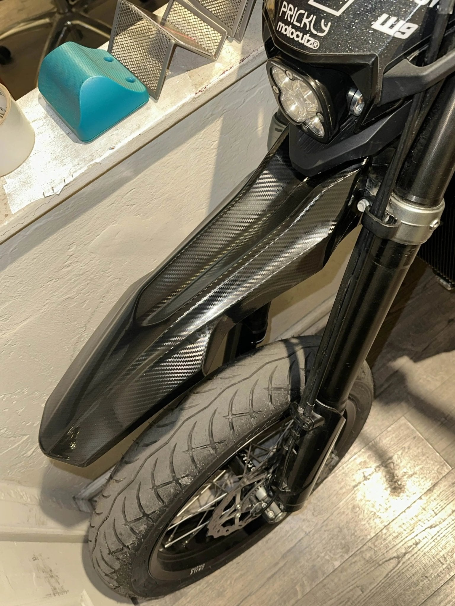 Carbon fiber side panel wrap on Sur-Ron Ultra Bee