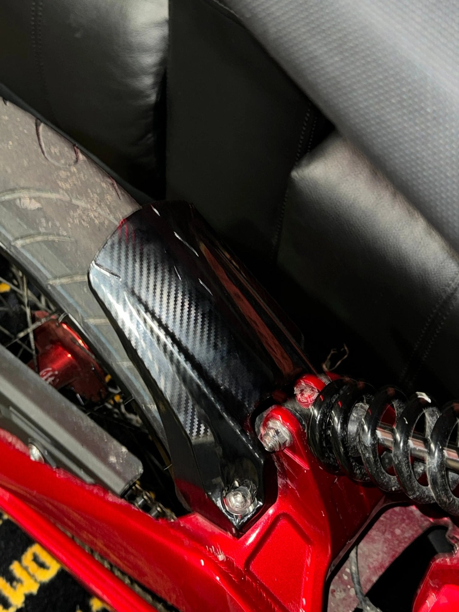 Carbon fiber motor cover wrap installed on a Talaria XXX
