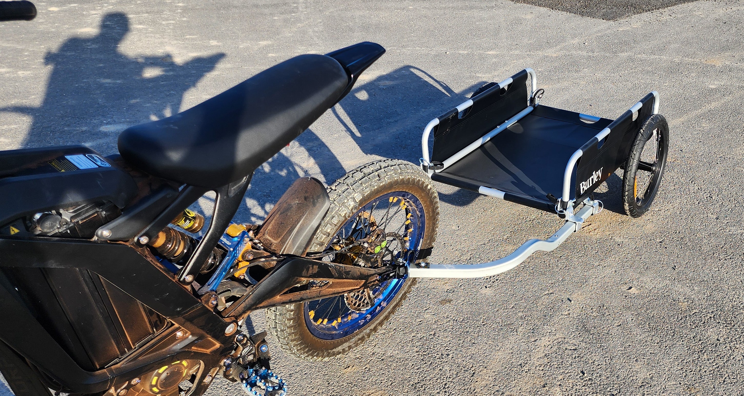 Close-up of Warp 9 trailer mount stainless steel adjustment bolt and captive axle design