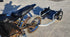 Close-up of Warp 9 trailer mount stainless steel adjustment bolt and captive axle design