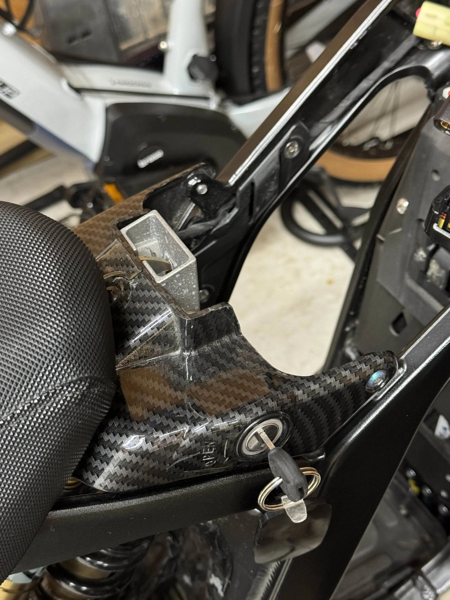 White carbon fiber wrap option for Sur-Ron LBX plastics
