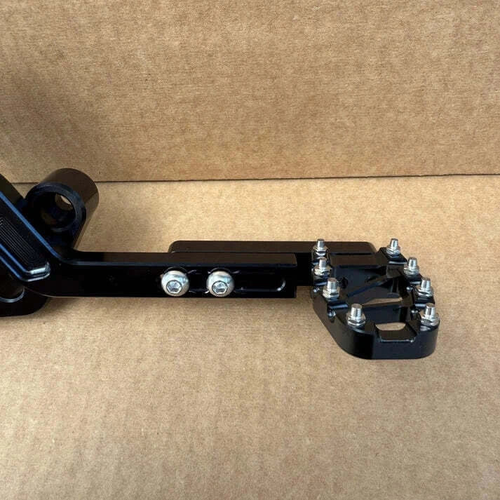 Foot brake extension for Surron Light Bee — side view