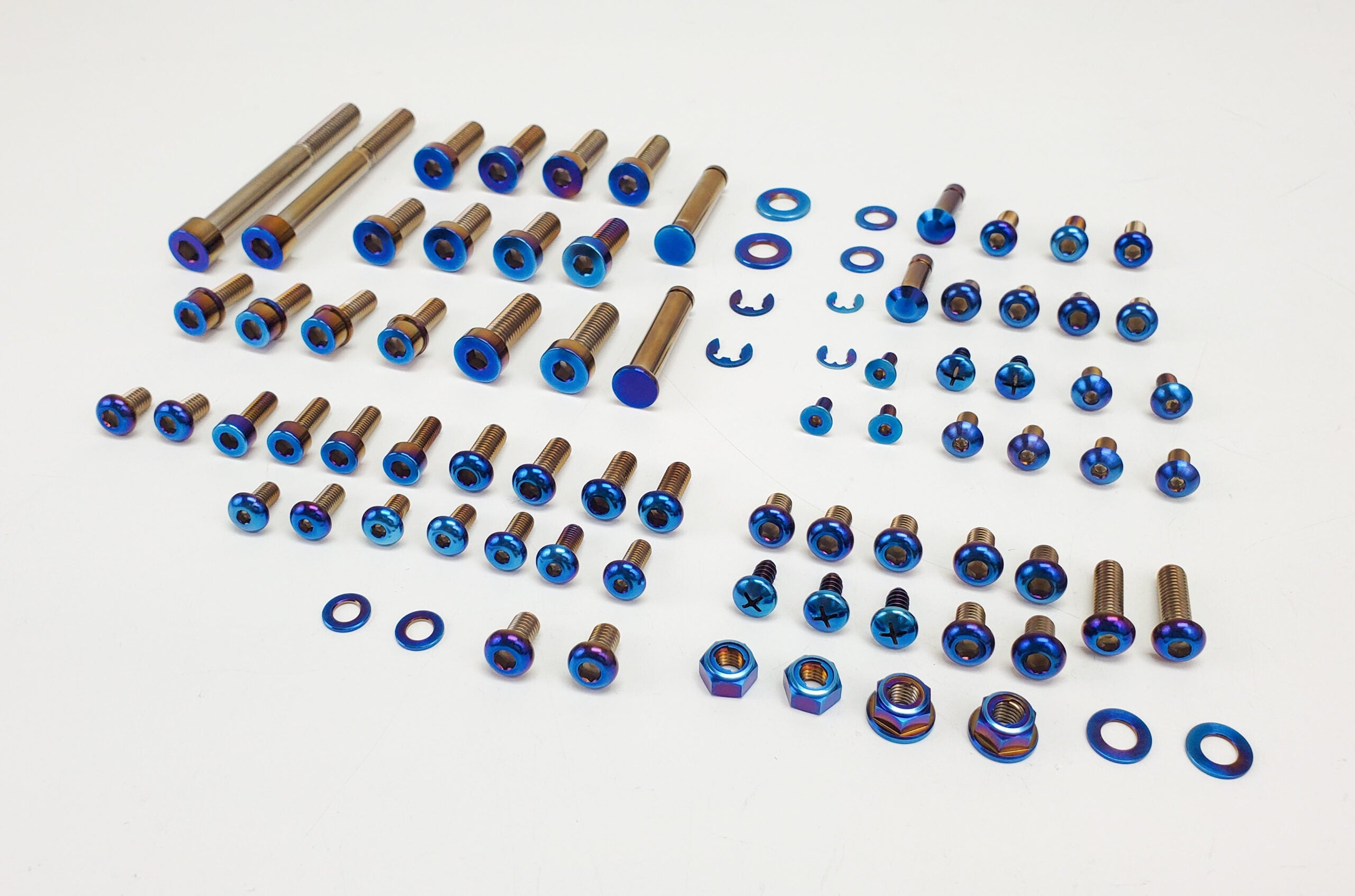 Warp 9 full titanium chassis bolt kit laid out for Talaria Sting MX3